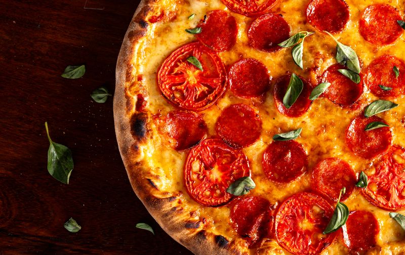 Factory Supreme pizza loaded with fresh vegetables and meats